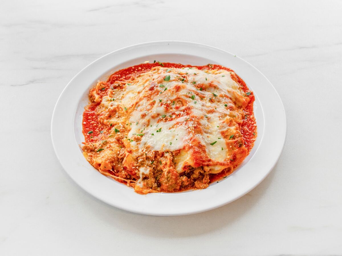 Baked pasta with melted cheese and tomato sauce